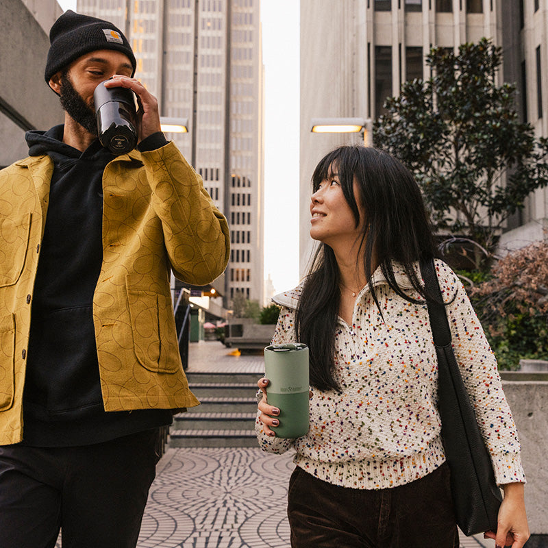 16oz-rise-tumbler-h2 16oz_rise_tumbler_black_iceberg_couple_drink_city_street_square.jpg