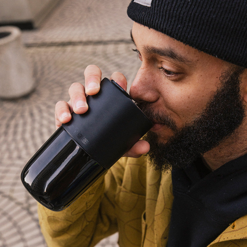 16oz-rise-tumbler-h2 16oz_rise_tumbler_black_man_drink_square.jpg