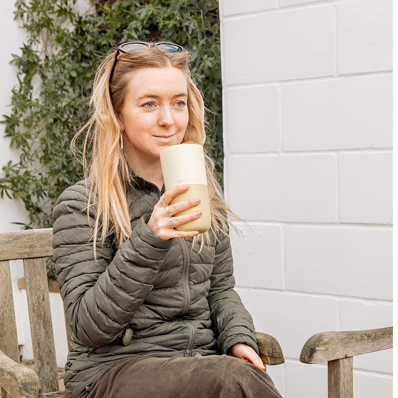 16oz-rise-tumbler-h2 16oz_rise_tumbler_wax_yellow_woman_seat_outside_square.jpg