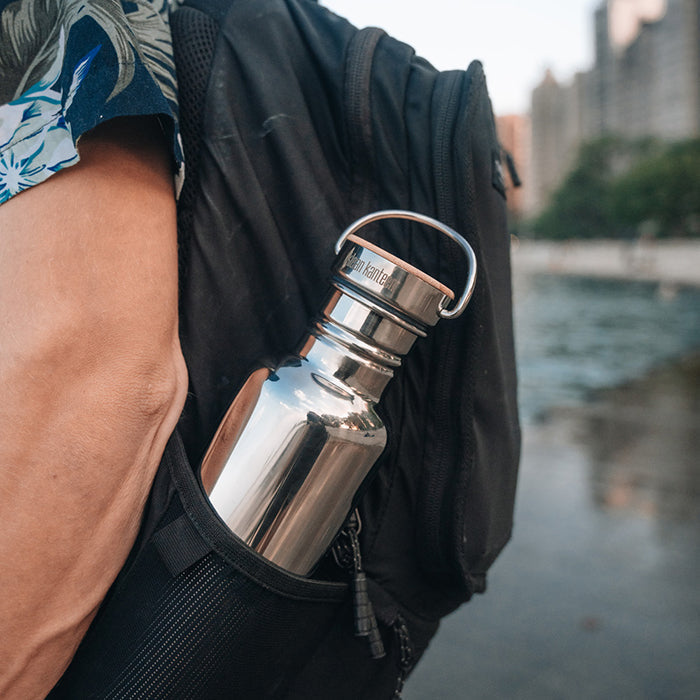 27oz-reflect-with-bamboo-cap-n1 K27SSLRF-MS-BAMBOO_reflect-bottle_backpack_lifestyle.jpg